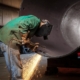 Worker using a welder on a large diameter pipe