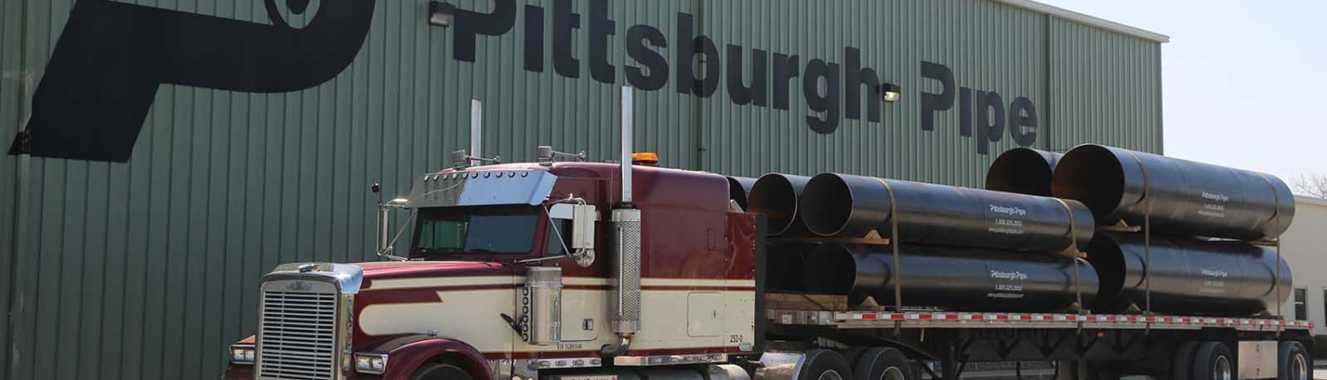 truck parked in front of pitts pipe building