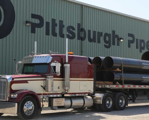 truck parked in front of pitts pipe building