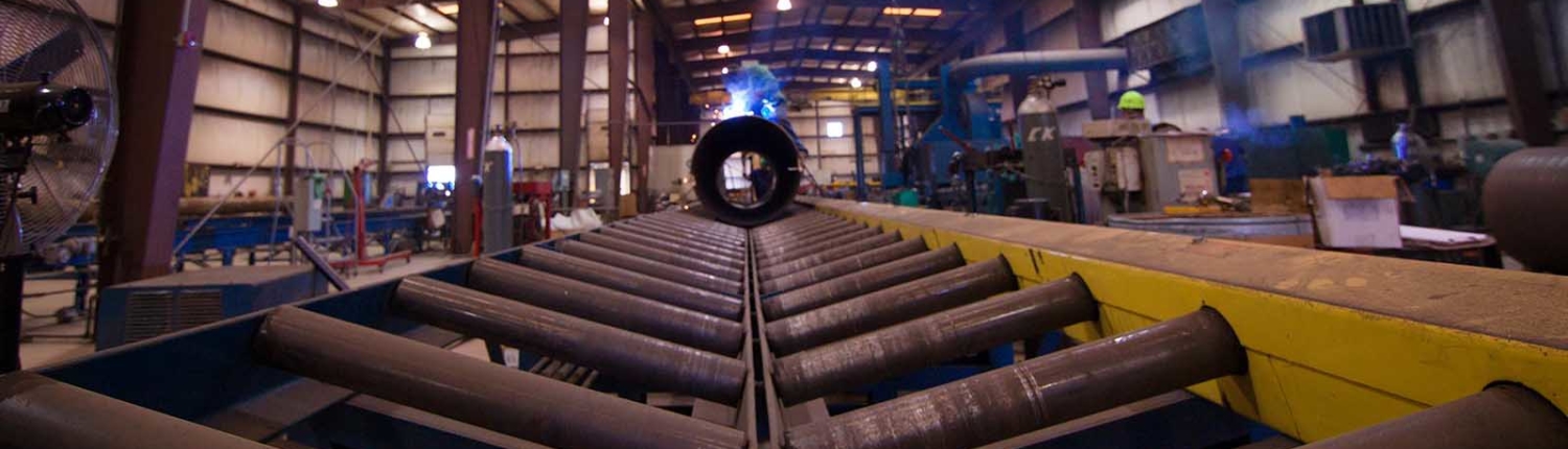 view of the rollers for pipes inside shop