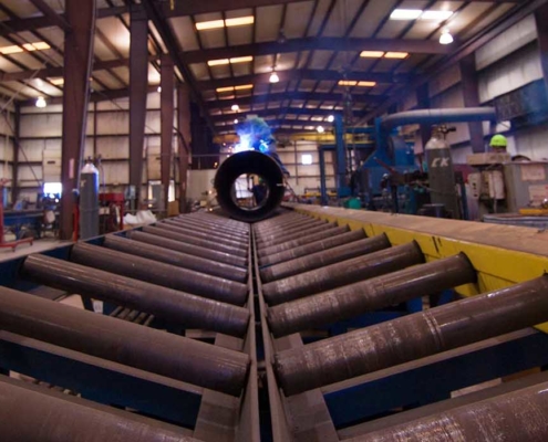 view of the rollers for pipes inside shop