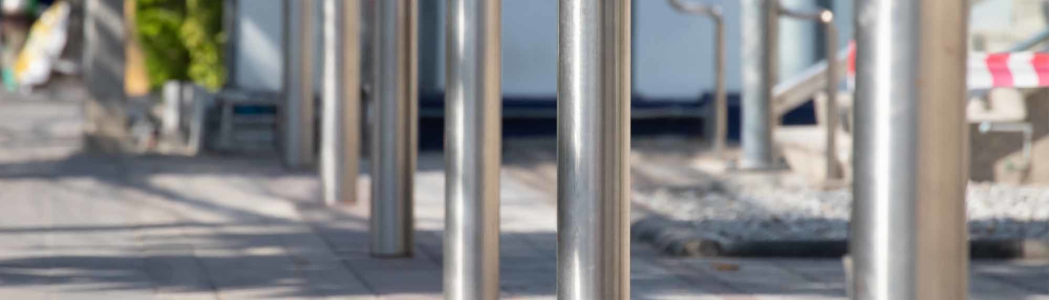 Steel bollards installed on the street side Trust Pittsburgh Pipe to Provide Removable Steel Bollards